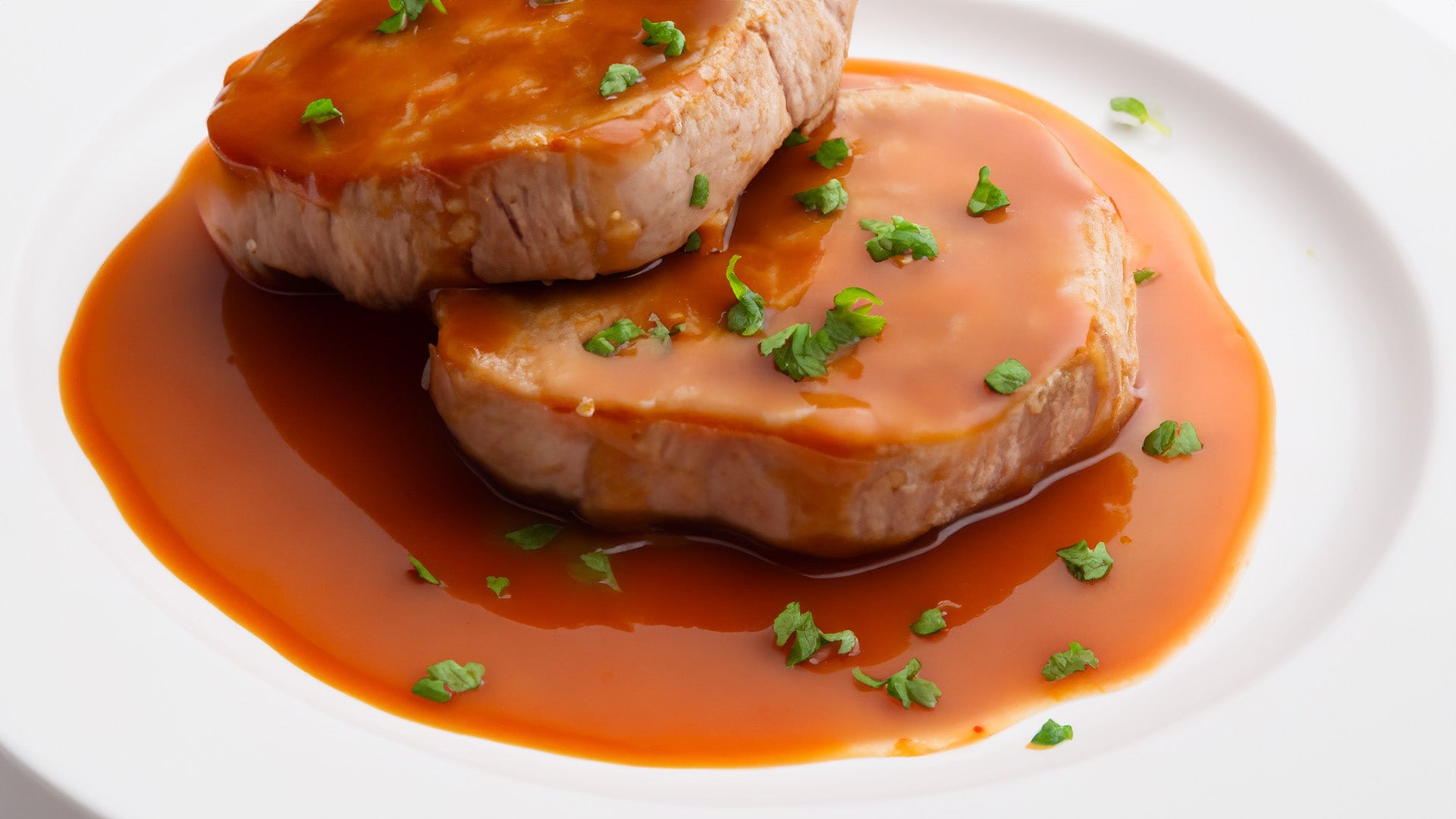 Chuletas de cerdo con salsa de naranja